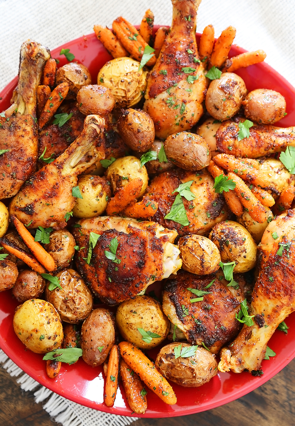 Chili-Garlic Roasted Chicken with Potatoes & Carrots - Spicy, crispy roasted chicken with tender potatoes and carrots! Just 1 pan + easy ingredients needed. So elegant and easy! Thecomfortofcooking.com