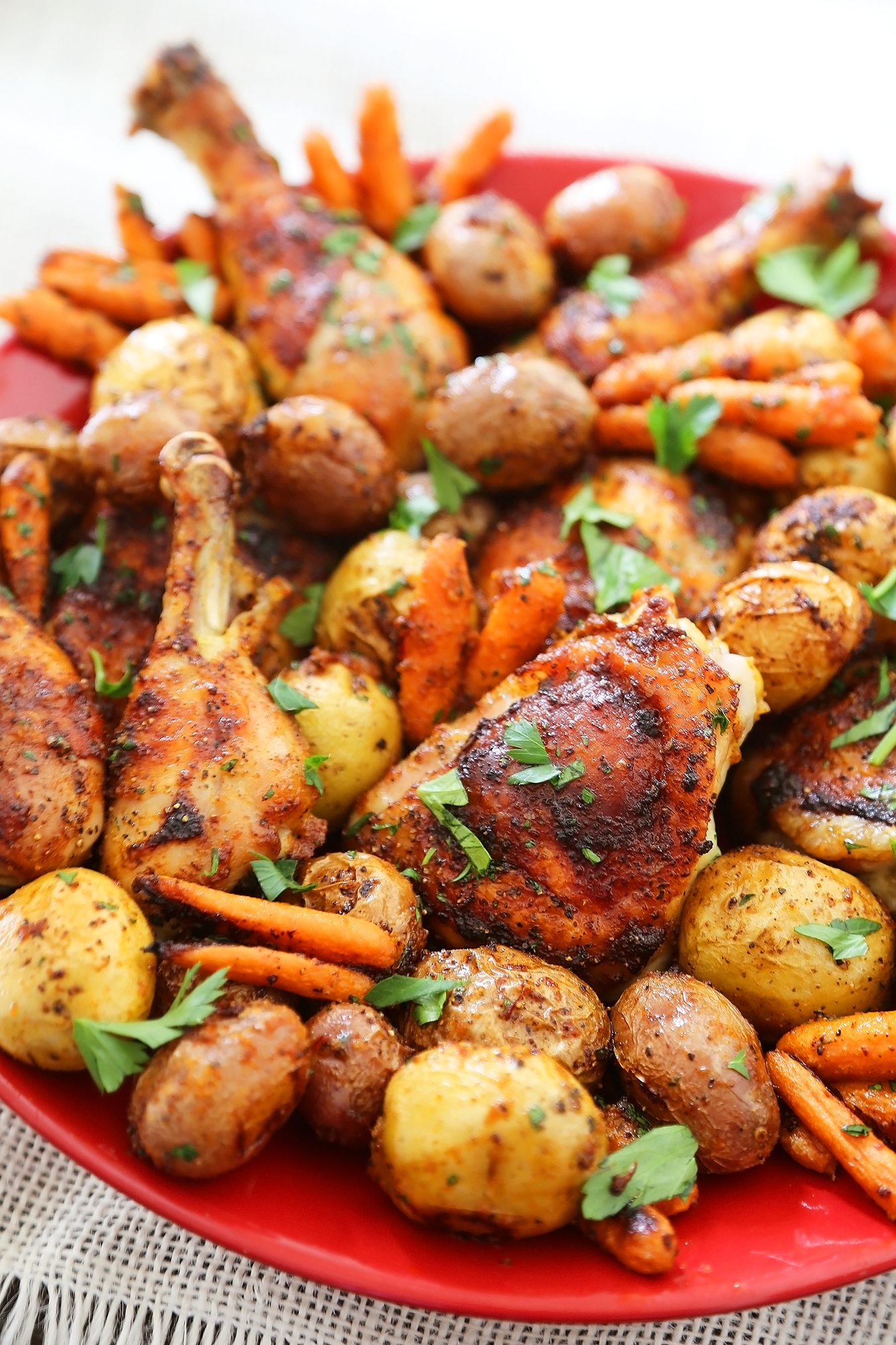 Chili-Garlic Roasted Chicken with Potatoes & Carrots - Spicy, crispy roasted chicken with tender potatoes and carrots! Just 1 pan + easy ingredients needed. So elegant and easy! Thecomfortofcooking.com