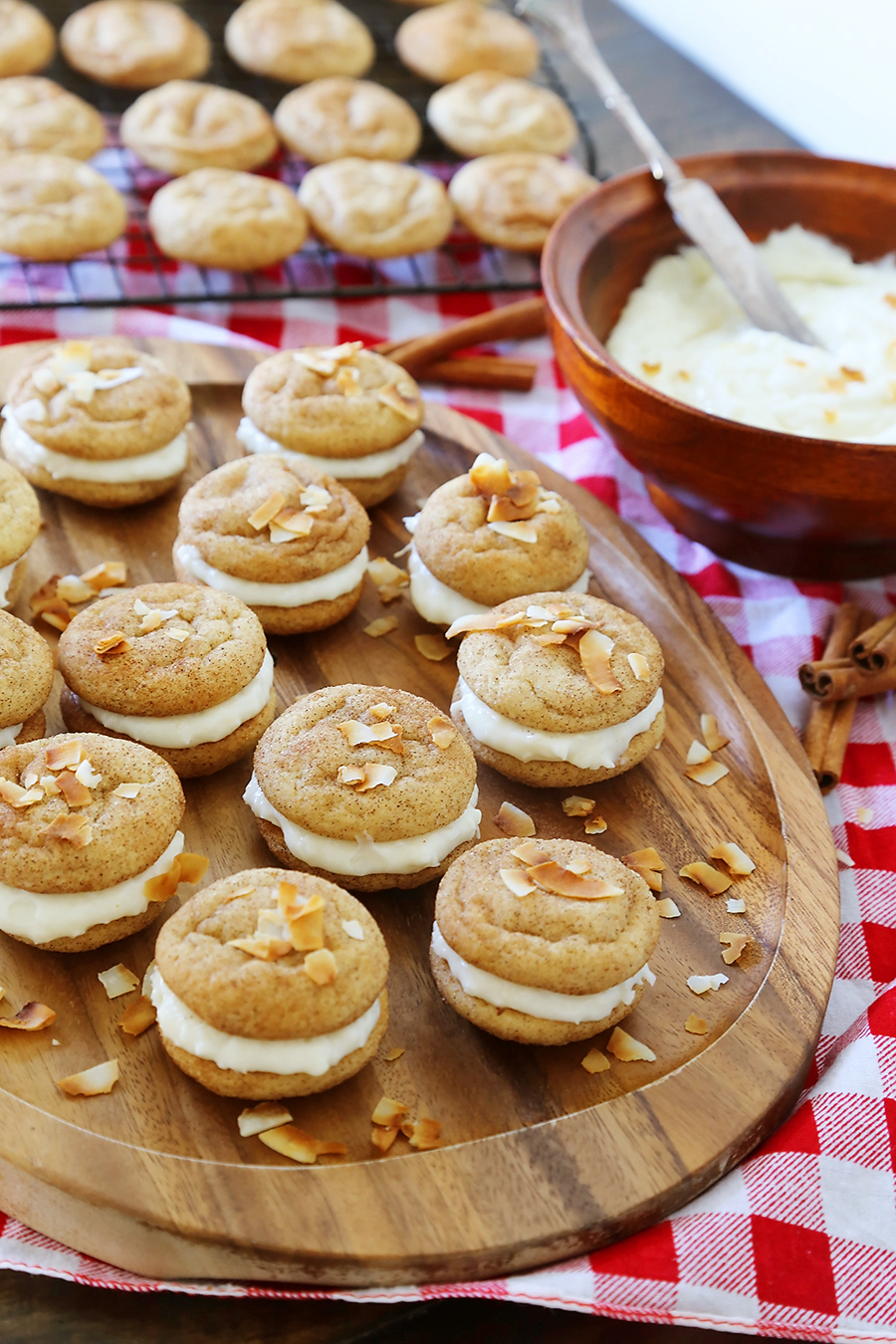 Snickerdoodle Sandwich Cookies with Coconut Cream Cheese Frosting - Super soft, buttery cinnamon-sugar cookies with a tangy coconut cream cheese frosting! Fun for kids to make and SO delicious! thecomfortofcooking.com