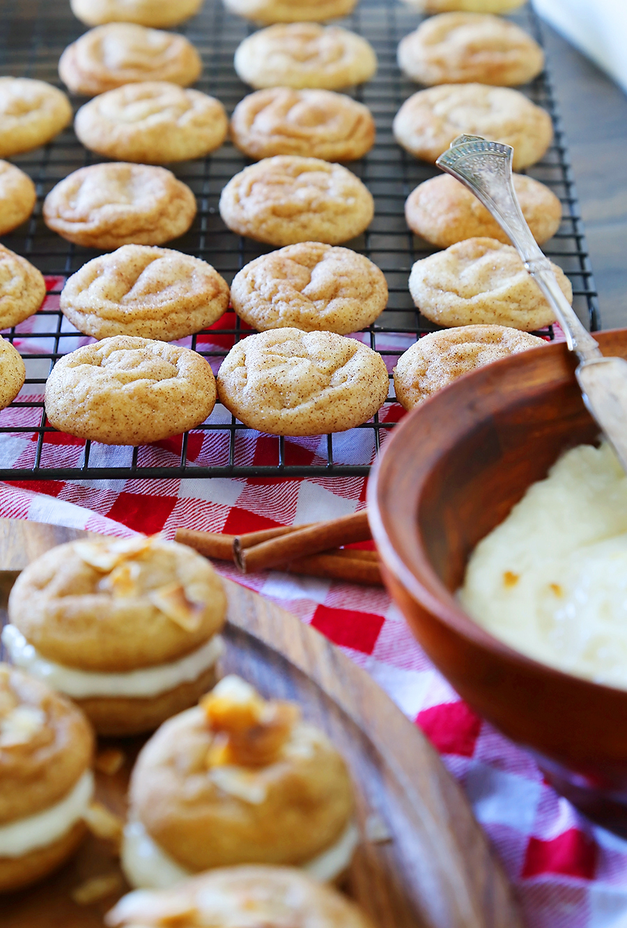 Snickerdoodle Sandwich Cookies with Coconut Cream Cheese Frosting - Super soft, buttery cinnamon-sugar cookies with a tangy coconut cream cheese frosting! Fun for kids to make and SO delicious! thecomfortofcooking.com