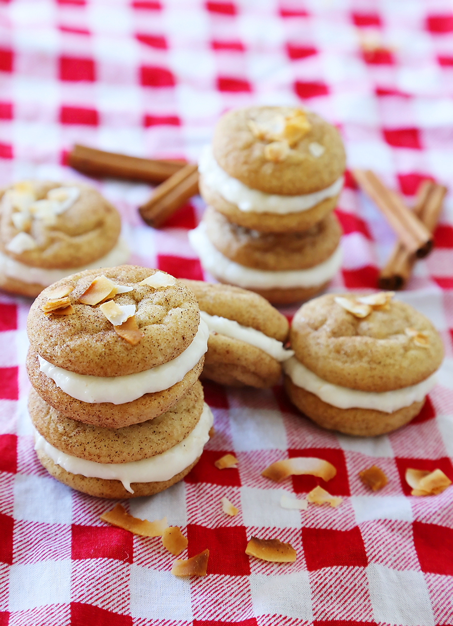 Snickerdoodle Sandwich Cookies with Coconut Cream Cheese Frosting - Super soft, buttery cinnamon-sugar cookies with a tangy coconut cream cheese frosting! Fun for kids to make and SO delicious! thecomfortofcooking.com