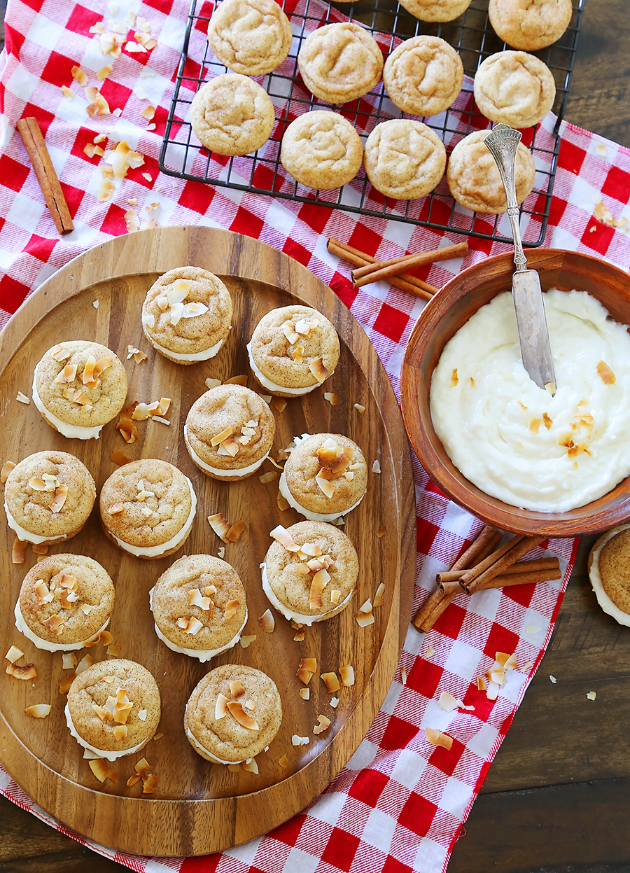 Snickerdoodle Sandwich Cookies with Coconut Cream Cheese Frosting - Super soft, buttery cinnamon-sugar cookies with a tangy coconut cream cheese frosting! Fun for kids to make and SO delicious! thecomfortofcooking.com