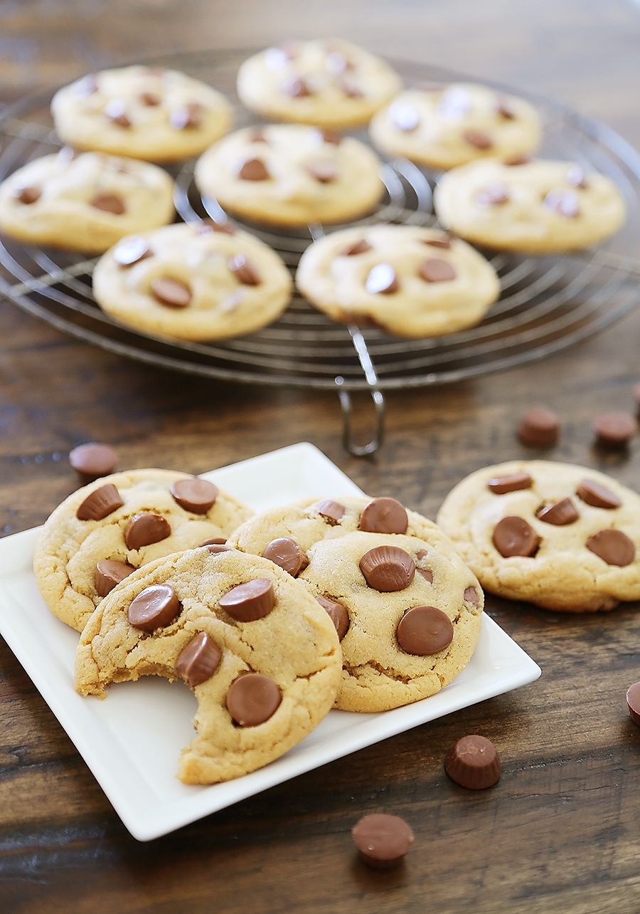 Soft Peanut Butter Cup Cookies - Perfectly soft and chewy peanut butter cookies, with gooey chocolate peanut butter cups hidden inside! Thecomfortofcooking.com