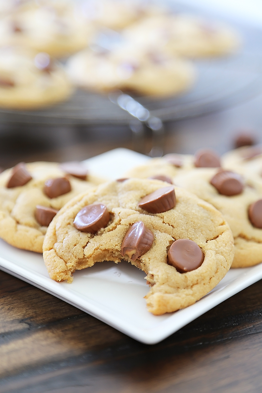 Soft Peanut Butter Cup Cookies - Perfectly soft and chewy peanut butter cookies, with gooey chocolate peanut butter cups hidden inside! Thecomfortofcooking.com