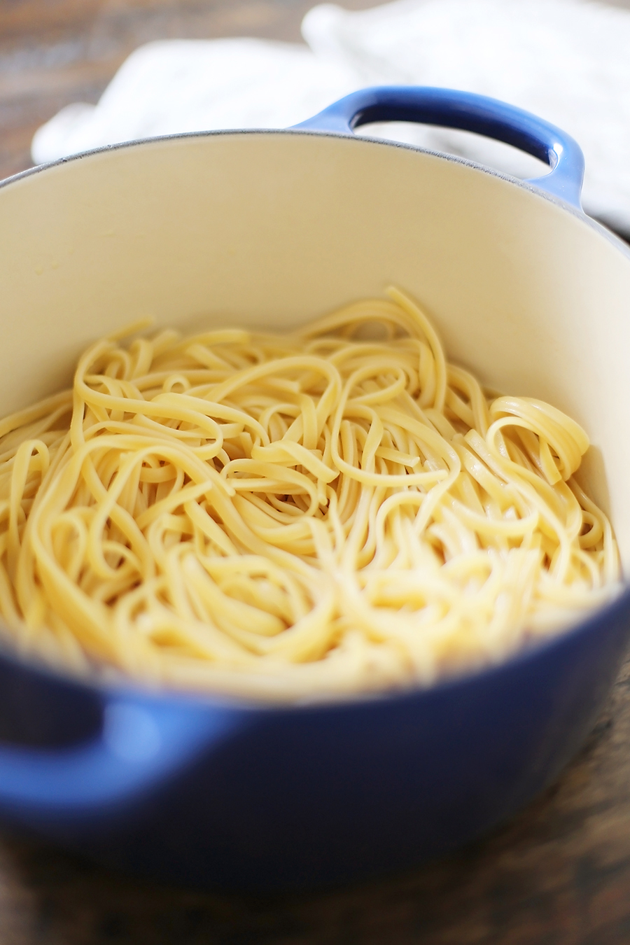 5-Ingredient Butter Roasted Tomato Sauce with Linguine - One of the most delicious, easy tomato + butter pasta sauces ever! Toss with hot cooked pasta and top with fresh Parmesan. So simple and scrumptious for weeknights! Thecomfortofcooking.com