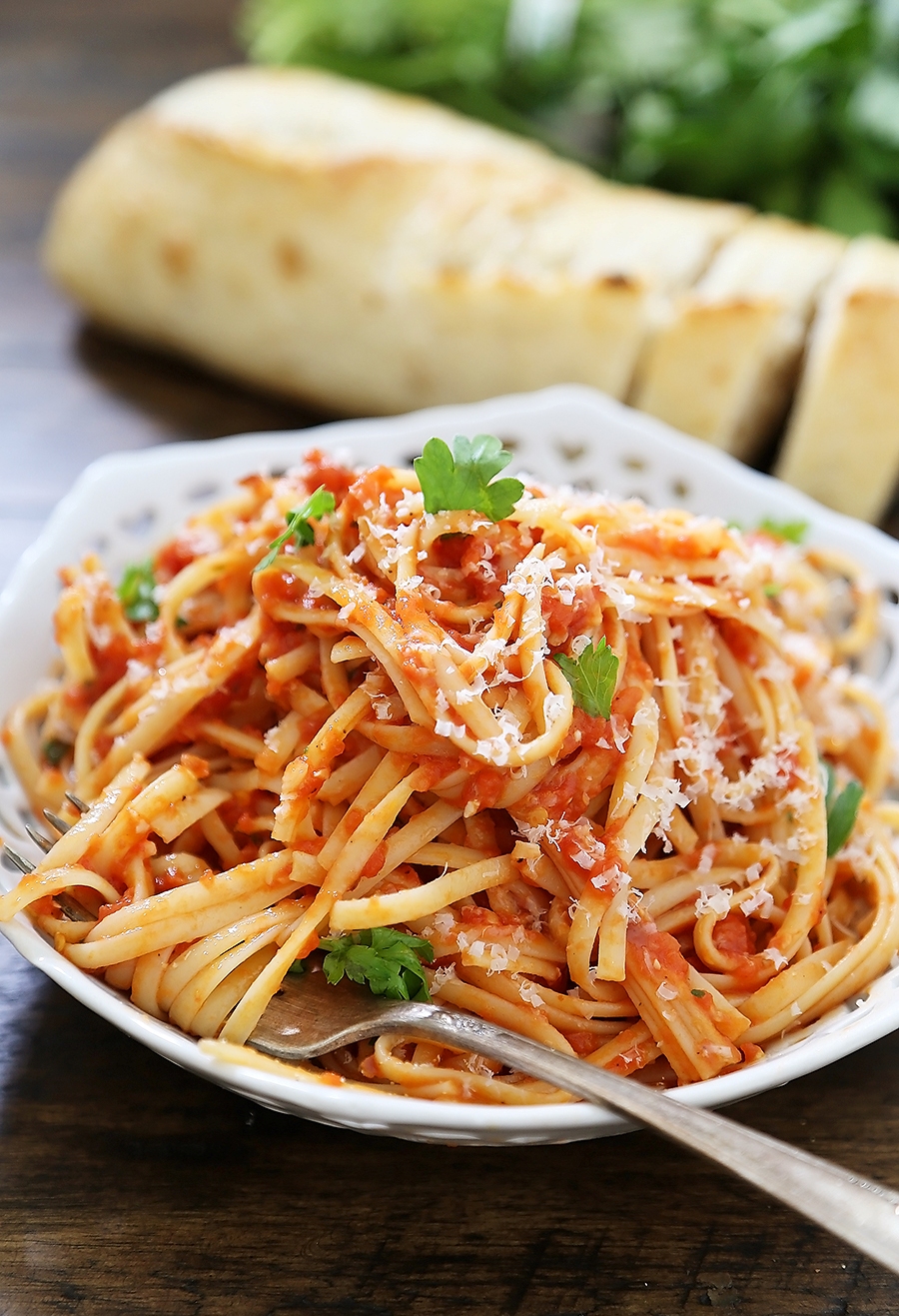 5-Ingredient Butter Roasted Tomato Sauce with Linguine - One of the most delicious, easy tomato + butter pasta sauces ever! Toss with hot cooked pasta and top with fresh Parmesan. So simple and scrumptious for weeknights! Thecomfortofcooking.com