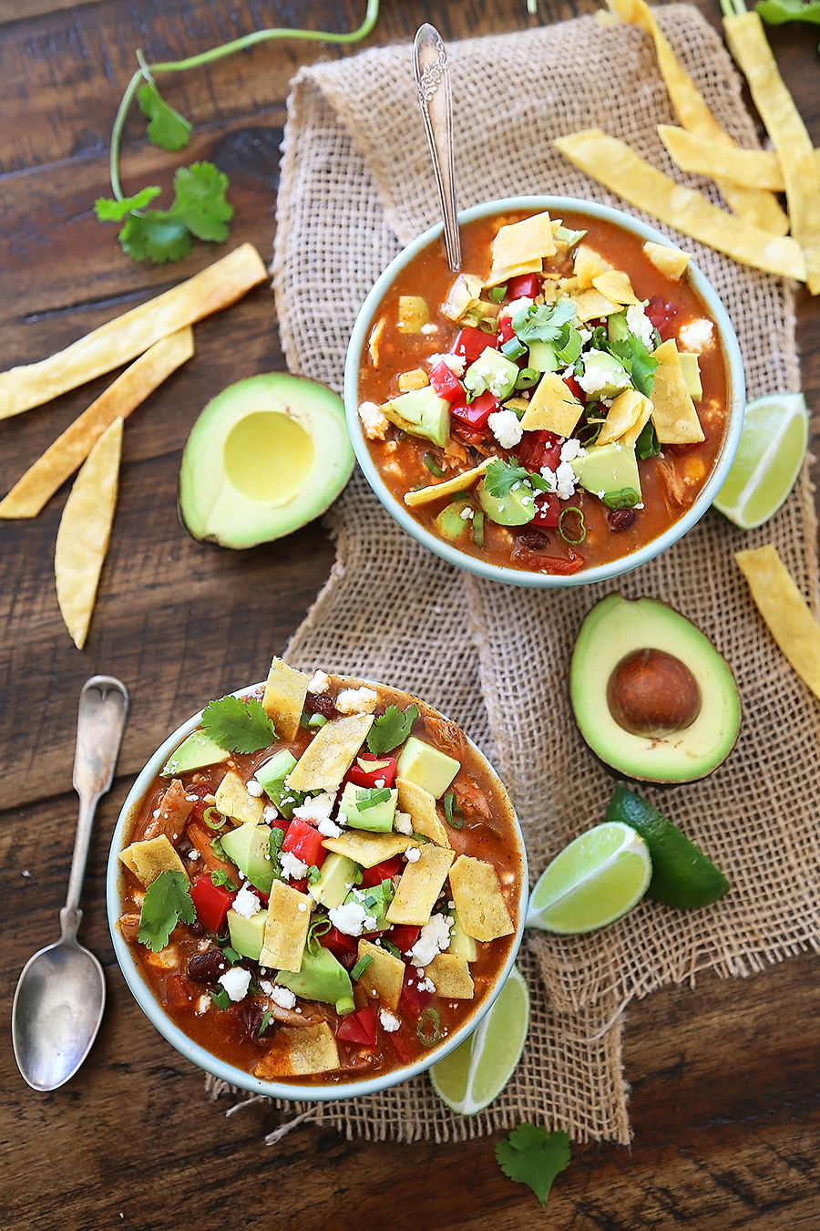 Easy Chicken Tortilla Soup - Serve this spicy, citrusy chicken tortilla soup for a fun twist on your weeknight meals! Add crunchy baked or fried tortilla strips (recipe included), cilantro, avocado and crumbled queso for a truly amazing soup! Thecomfortofcooking.com