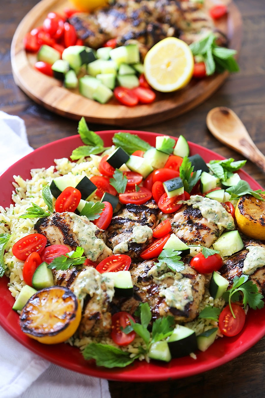 Greek Tahini Chicken with Cucumber, Tomato and Lemon Orzo Salad - Smoky, tender marinated chicken thighs with a creamy tahini sauce, fresh veggies, orzo and a squeeze of lemon! Full of nutritious, hearty goodness! Thecomfortofcooking.com