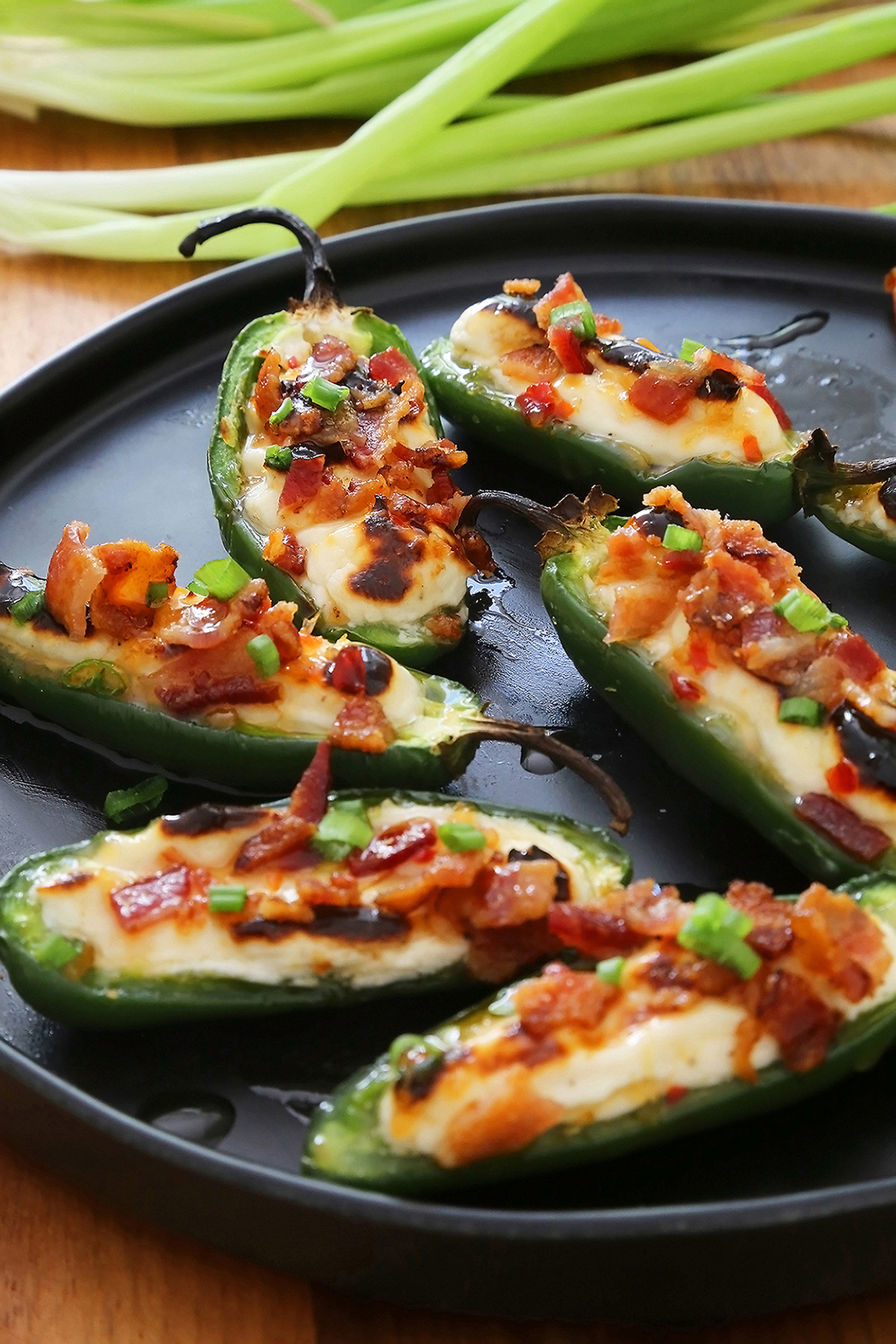 Bacon-Goat Cheese Jalapeño Poppers - Salty-crisp bacon, creamy goat cheese, savory-sweet jelly, all tucked into a roasted jalapeño! Thecomfortofcooking.com