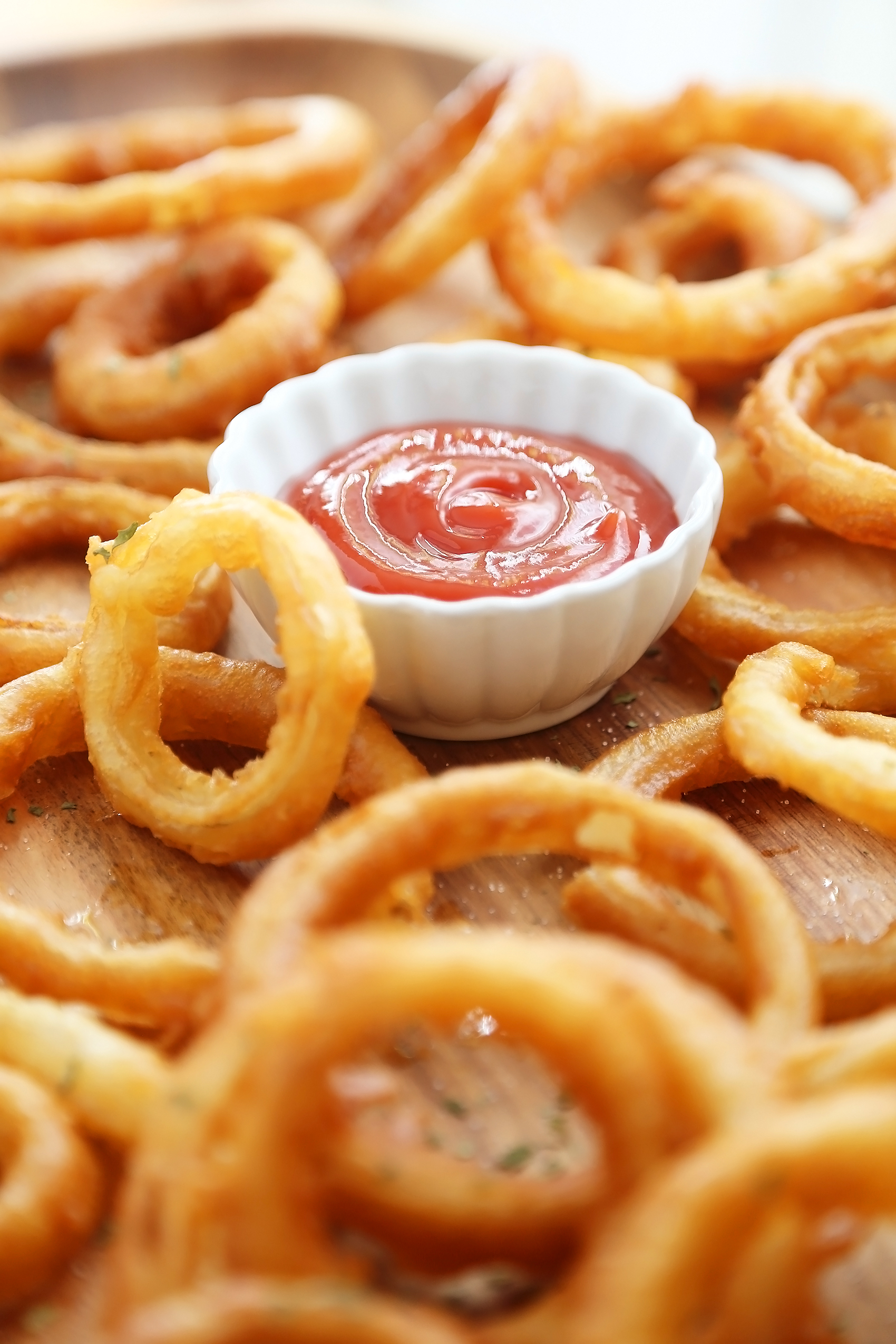 Foolproof Crispy Onion Rings - Snack on a stack of these crispy, salty onion rings! Best-ever recipe for the perfect game-day and family night comfort food! thecomfortofcooking.com