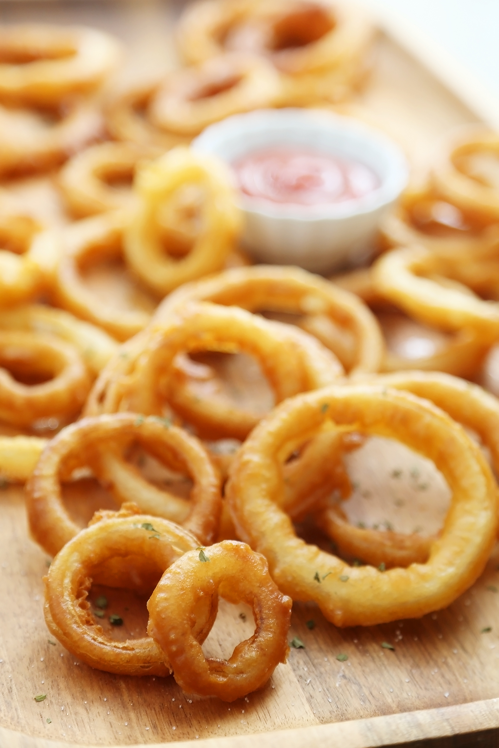 Foolproof Crispy Onion Rings - Snack on a stack of these crispy, salty onion rings! Best-ever recipe for the perfect game-day and family night comfort food! thecomfortofcooking.com