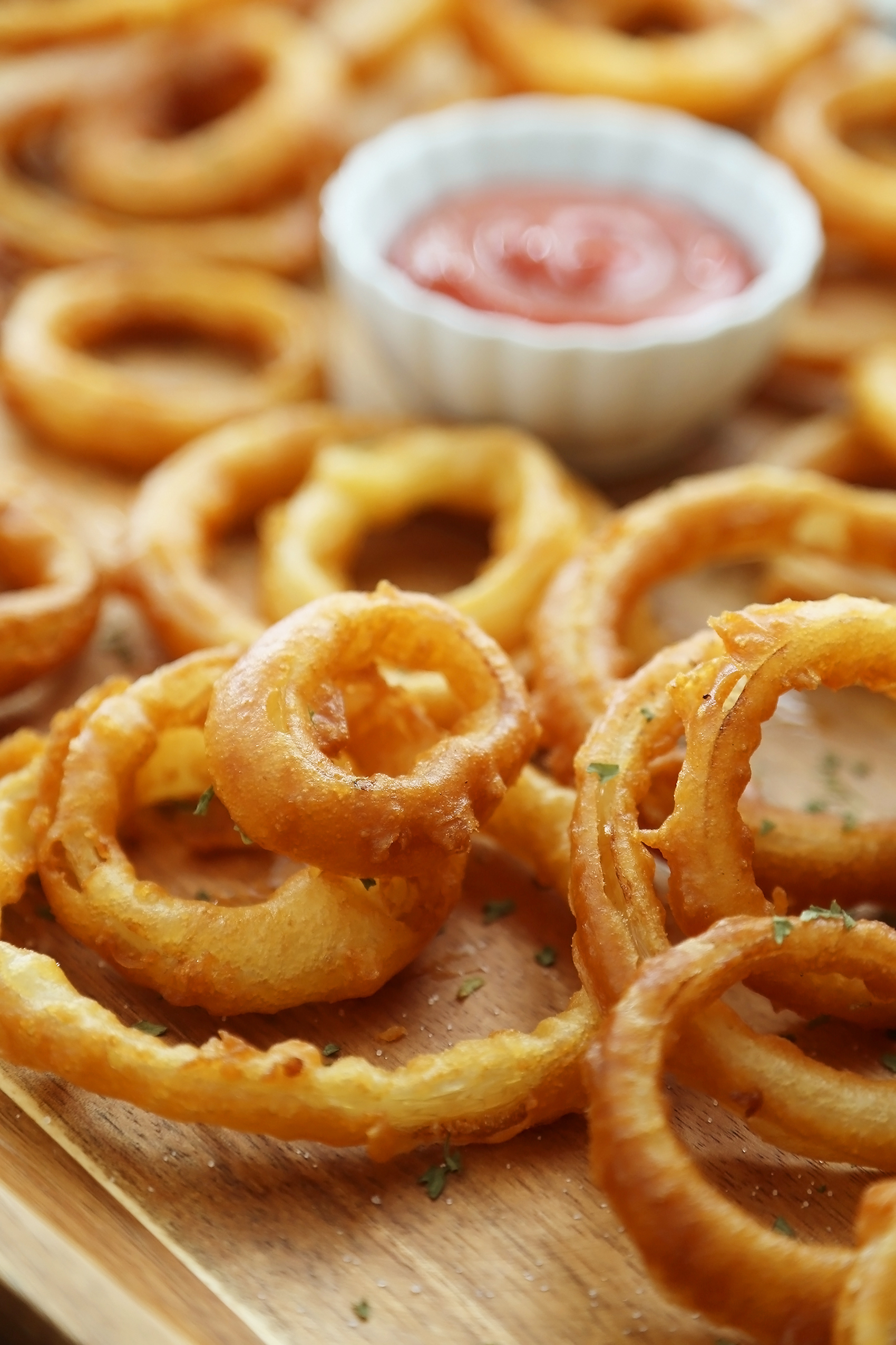 Foolproof Crispy Onion Rings - Snack on a stack of these crispy, salty onion rings! Best-ever recipe for the perfect game-day and family night comfort food! thecomfortofcooking.com