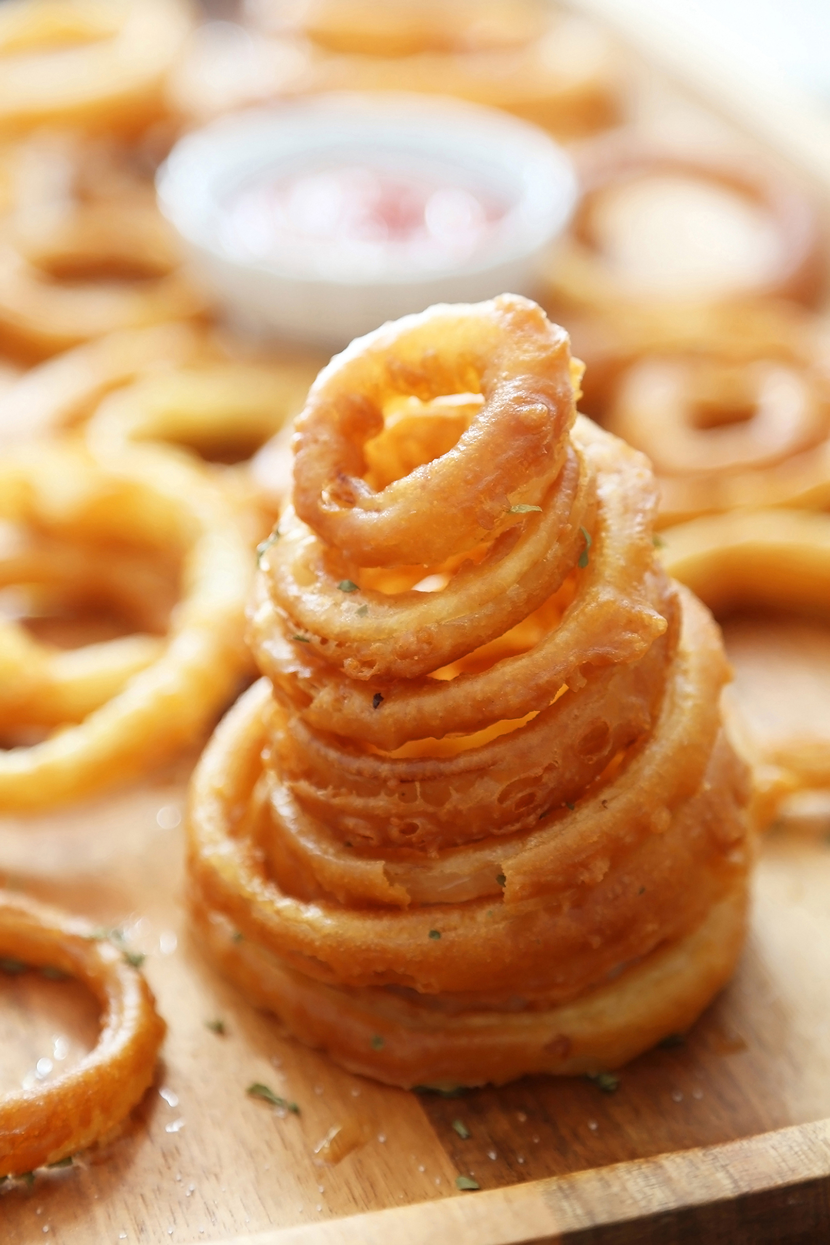 Foolproof Crispy Onion Rings - Snack on a stack of these crispy, salty onion rings! Best-ever recipe for the perfect game-day and family night comfort food! thecomfortofcooking.com