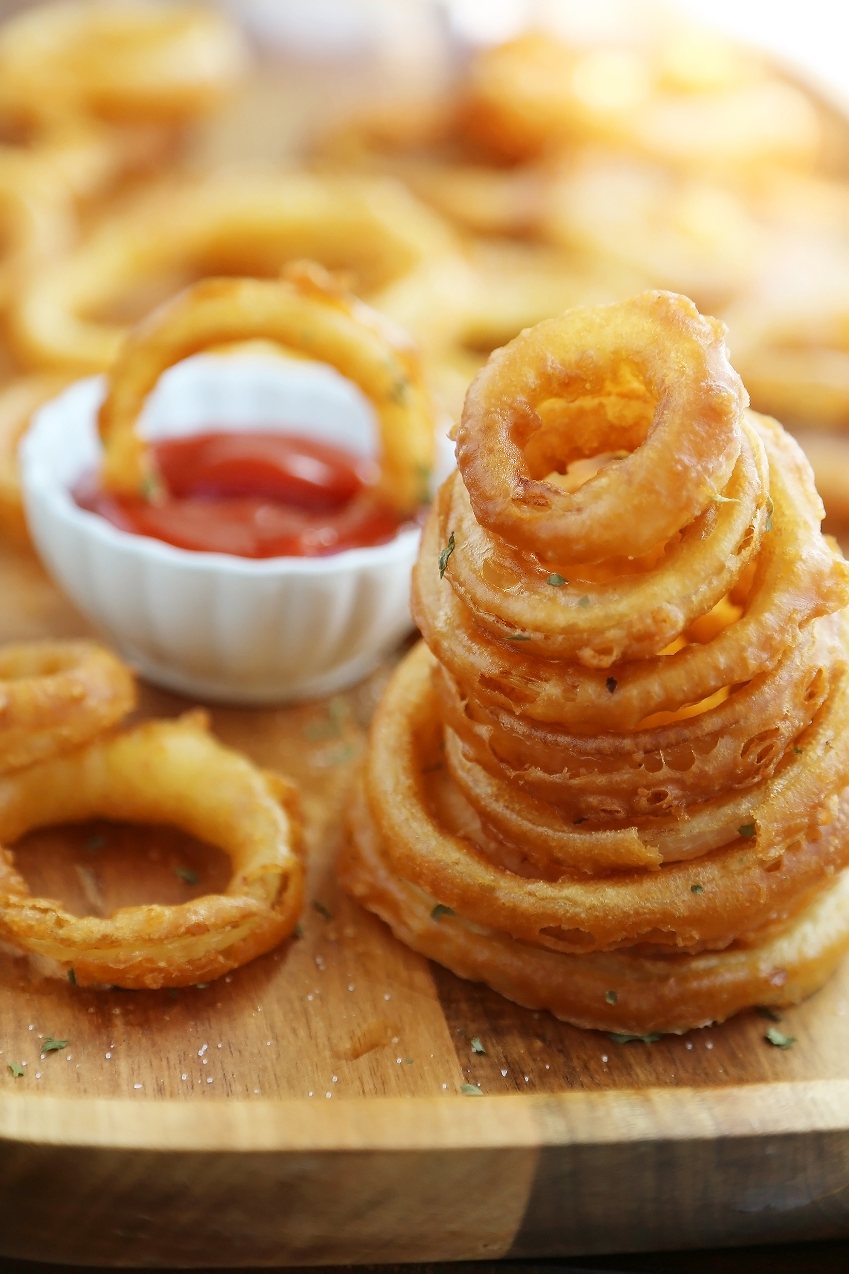 Foolproof Crispy Onion Rings - Snack on a stack of these crispy, salty onion rings! Best-ever recipe for the perfect game-day and family night comfort food! thecomfortofcooking.com