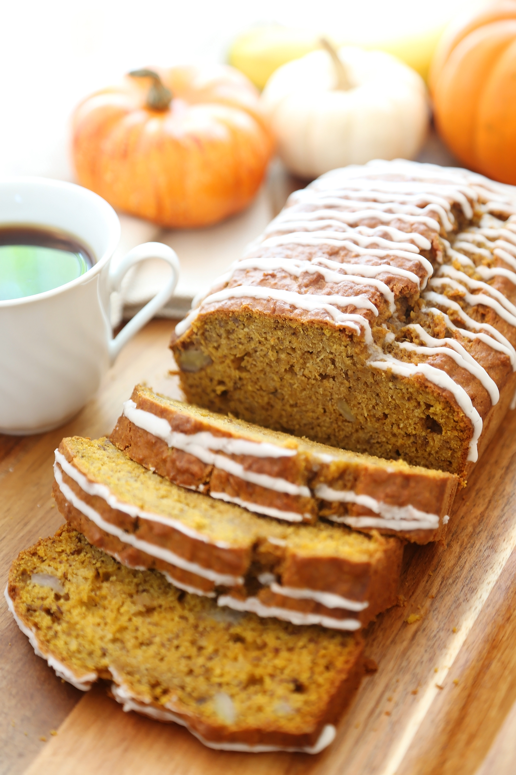 Pumpkin Banana Bread with Vanilla Glaze - Super moist, fluffy pumpkin-banana bread easily baked from scratch! Perfect for gifting or enjoying for breakfast, brunch or dessert. Thecomfortofcooking.com