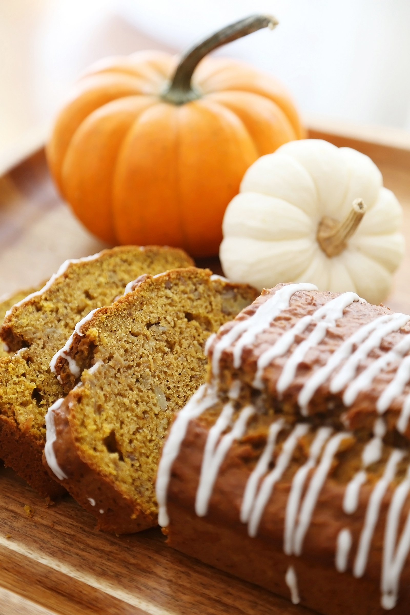 Pumpkin Banana Bread with Vanilla Glaze - Super moist, fluffy pumpkin-banana bread easily baked from scratch! Perfect for gifting or enjoying for breakfast, brunch or dessert. Thecomfortofcooking.com