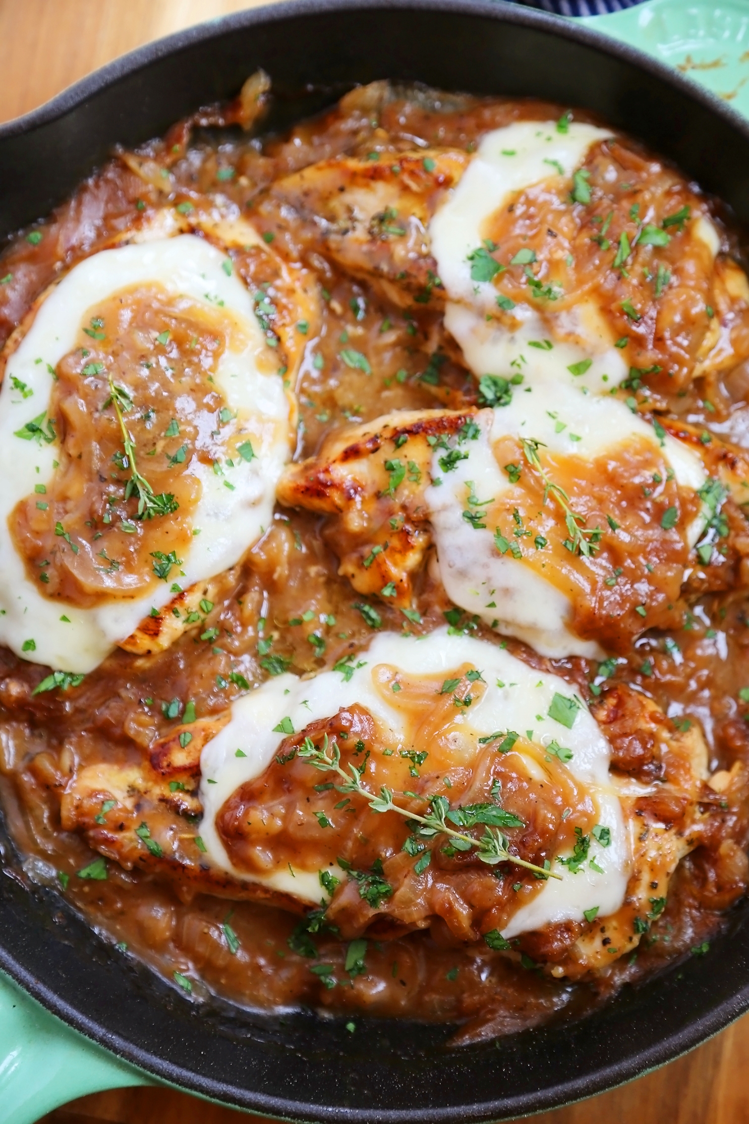 Skillet French Onion Chicken - Saucy, melt-in-your-mouth French onion chicken smothered in caramelized onion gravy, topped with melted cheese. Thecomfortofcooking.com