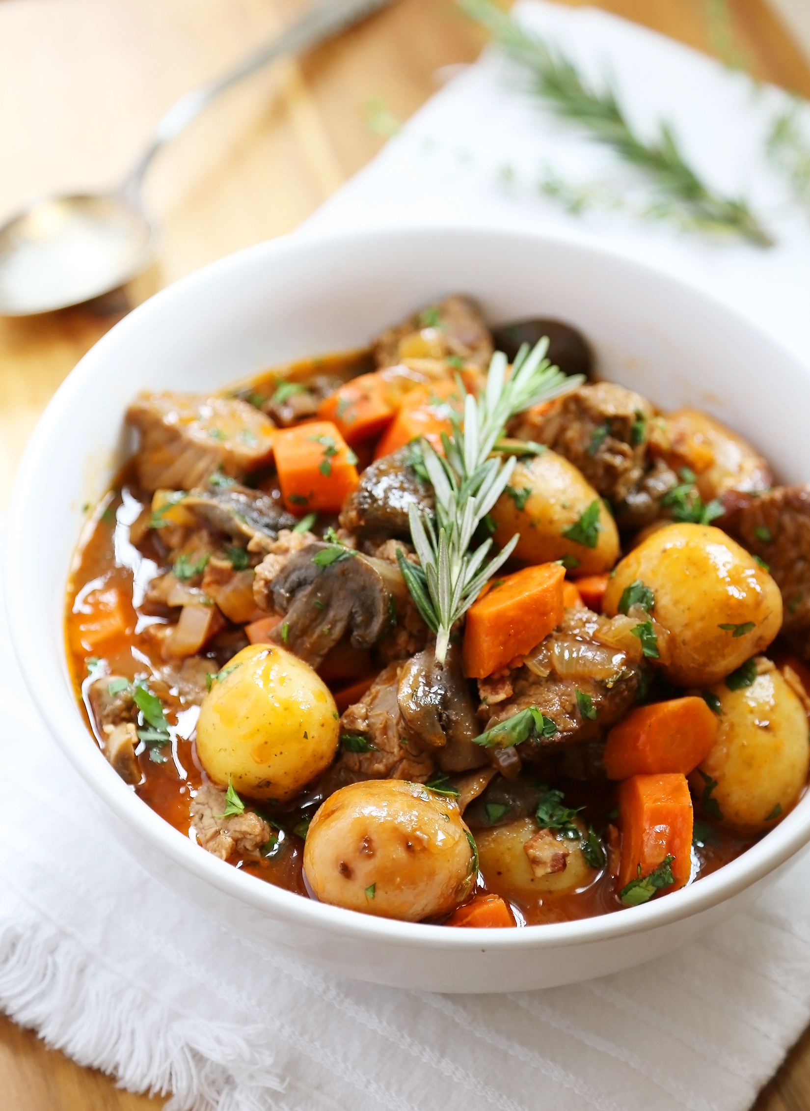 Slow Cooker Beef Bourguignon - Hearty veggies meet juicy, tender beef in this classic French stew. Thecomfortofcooking.com