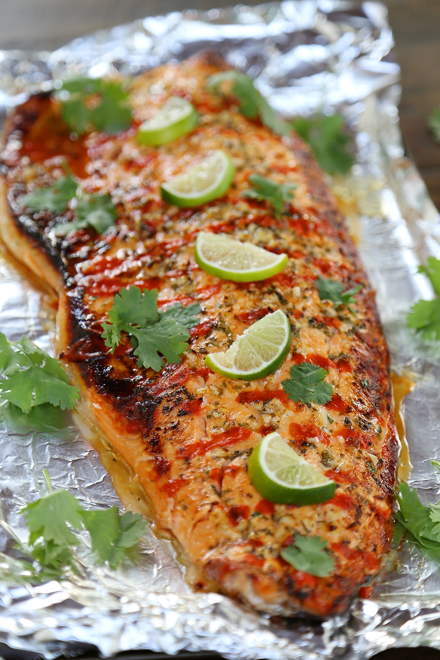 Honey Cilantro Lime Salmon in Foil - Buttery, flaky salmon fillet that melts in your mouth. So quick & easy! thecomfortofcooking.com