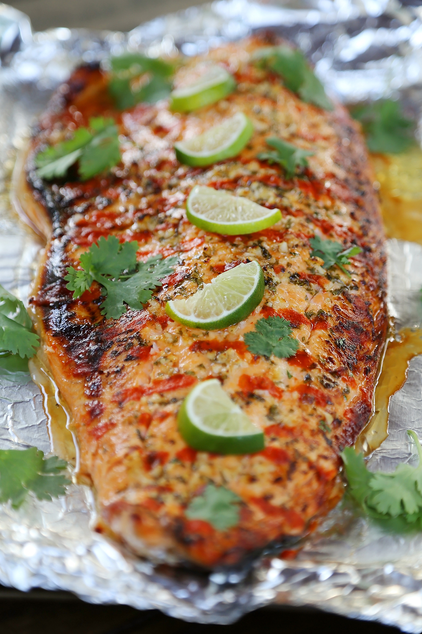 Honey Cilantro Lime Salmon in Foil - Buttery, flaky salmon fillet that melts in your mouth. So quick & easy! thecomfortofcooking.com