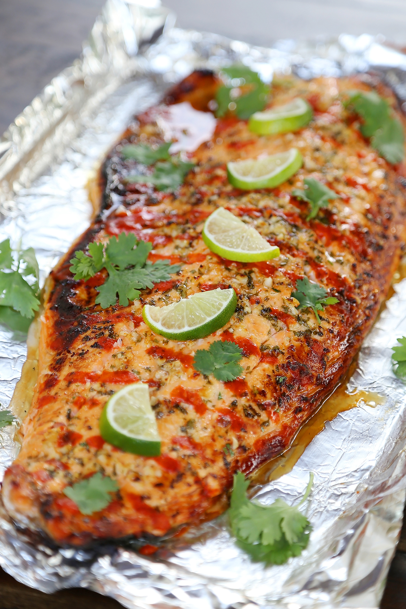 Honey Cilantro Lime Salmon in Foil - Buttery, flaky salmon fillet that melts in your mouth. So quick & easy! thecomfortofcooking.com