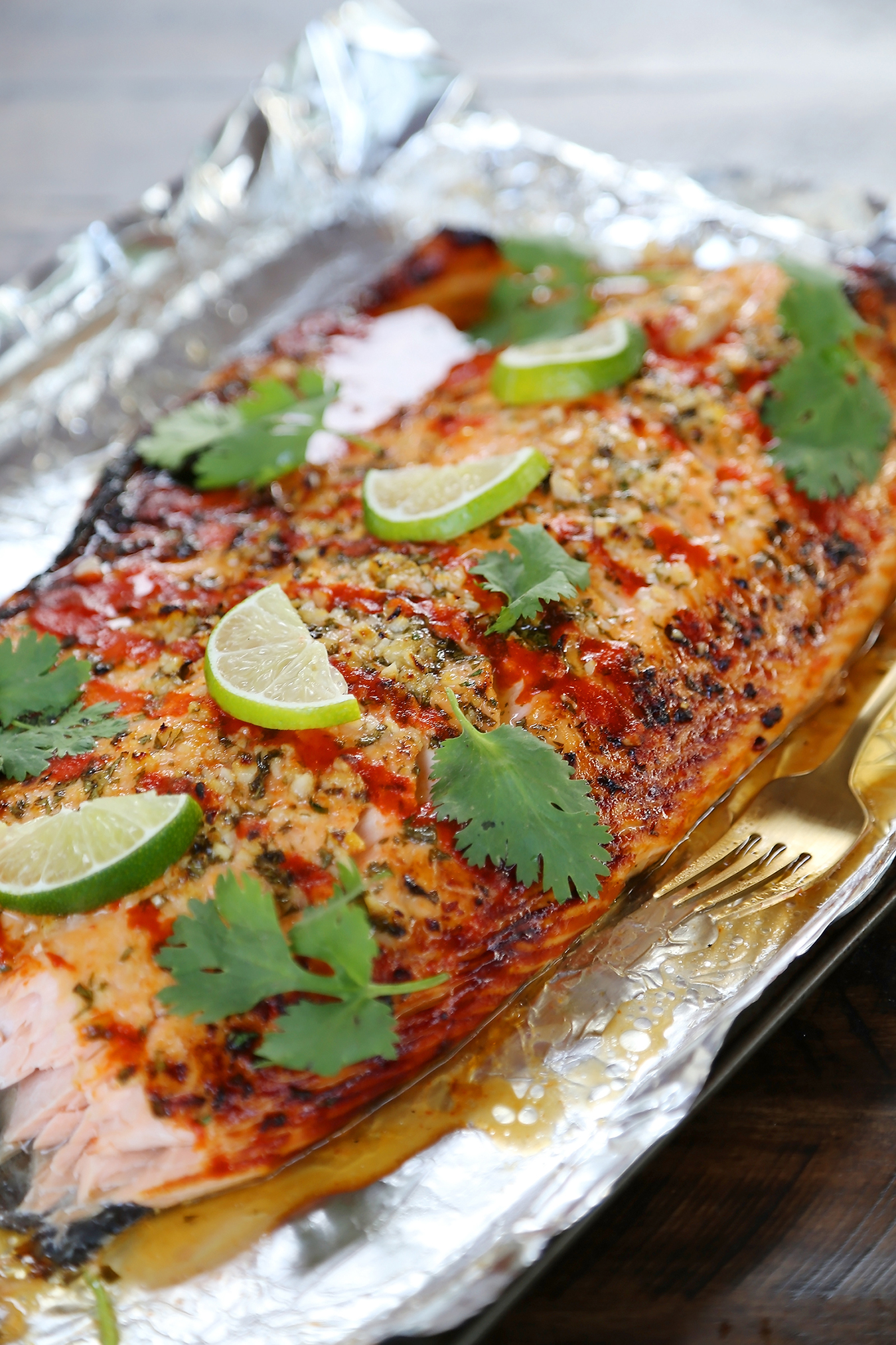 Honey Cilantro Lime Salmon in Foil - Buttery, flaky salmon fillet that melts in your mouth. So quick & easy! thecomfortofcooking.com