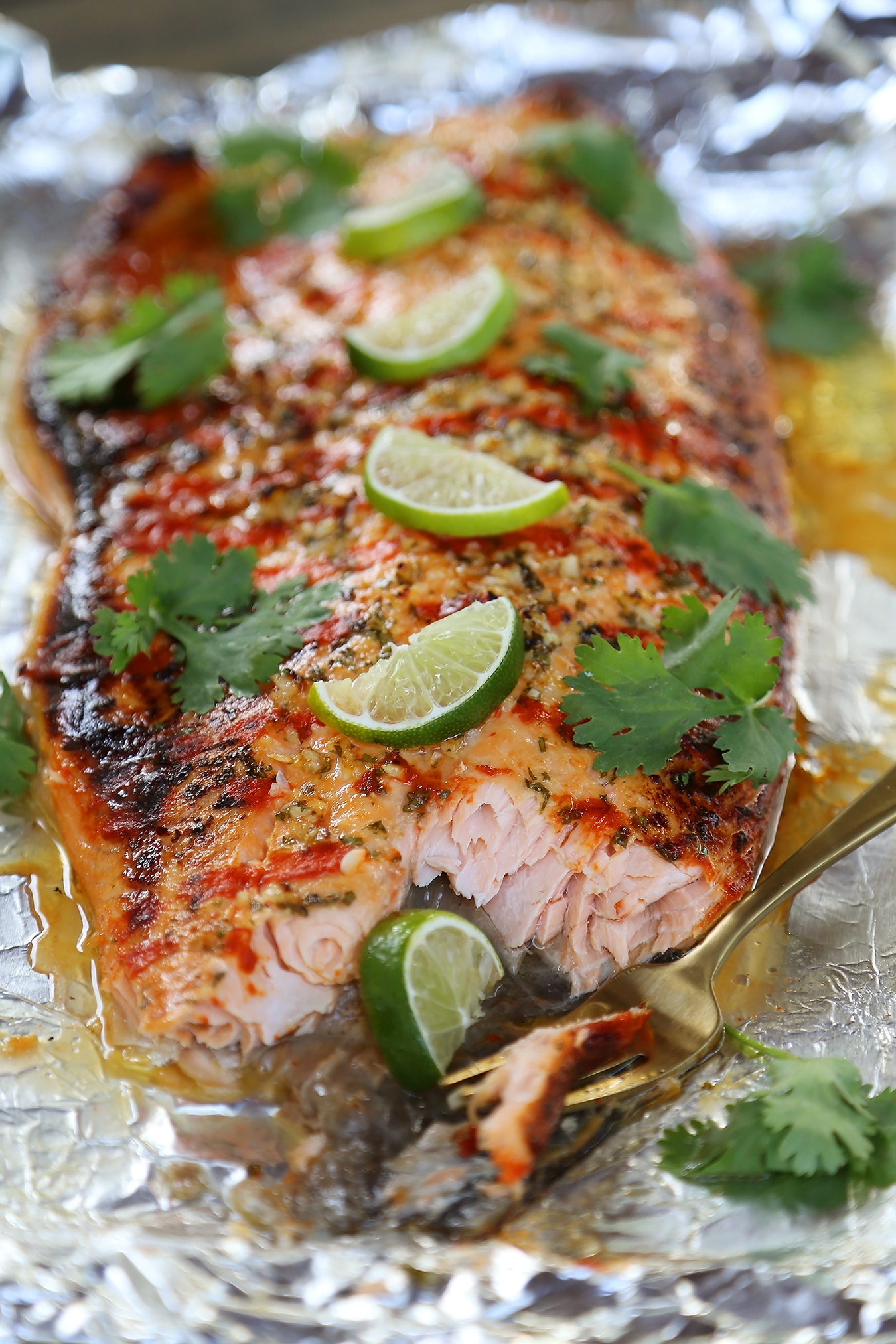 Honey Cilantro Lime Salmon in Foil - Buttery, flaky salmon fillet that melts in your mouth. So quick & easy! thecomfortofcooking.com