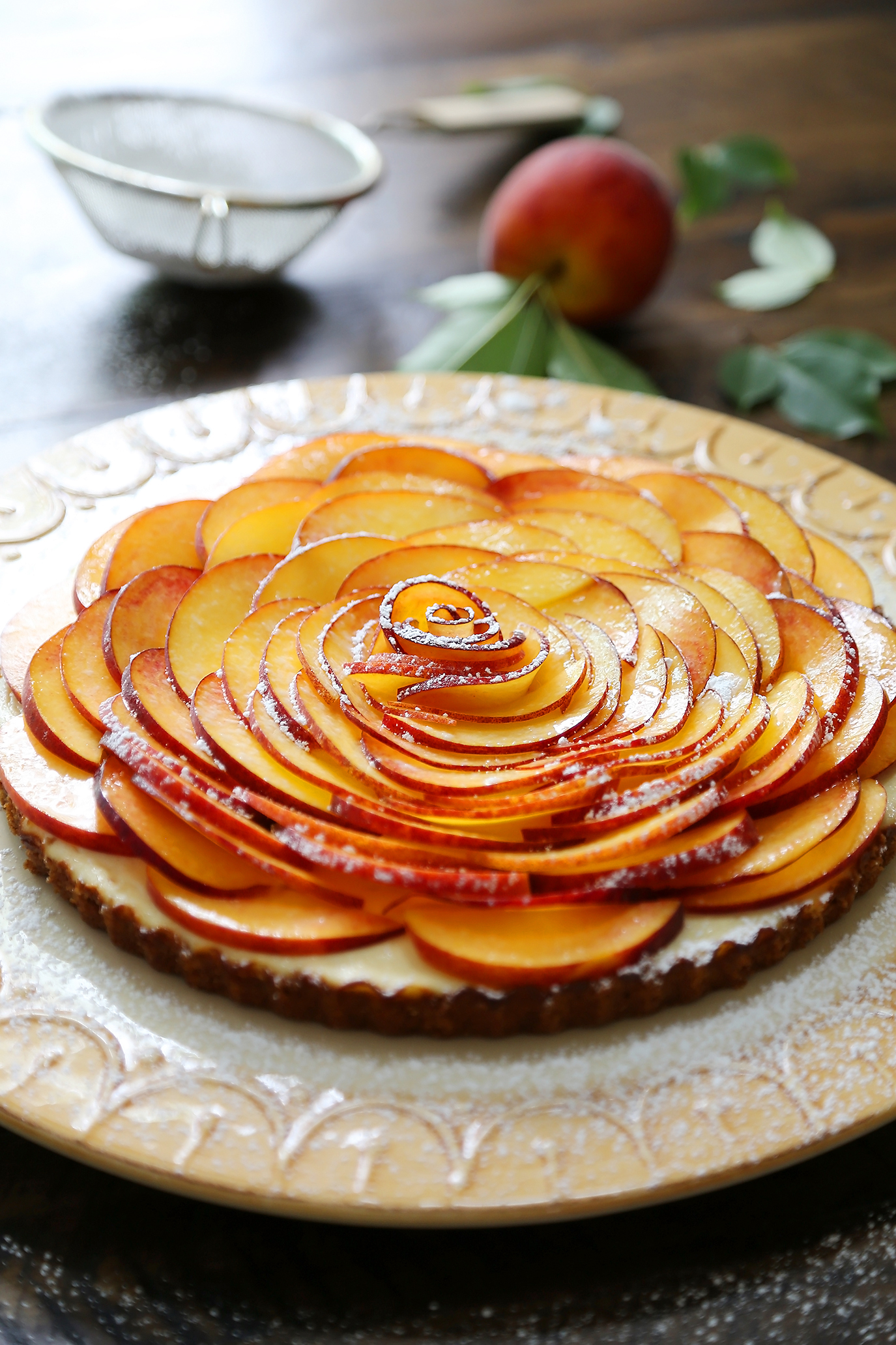 Creamy Peach and Honey Tart - Silky, rich cheesecake tart with a 5-ingredient filling. The perfect simple summer dessert! thecomfortofcooking.com