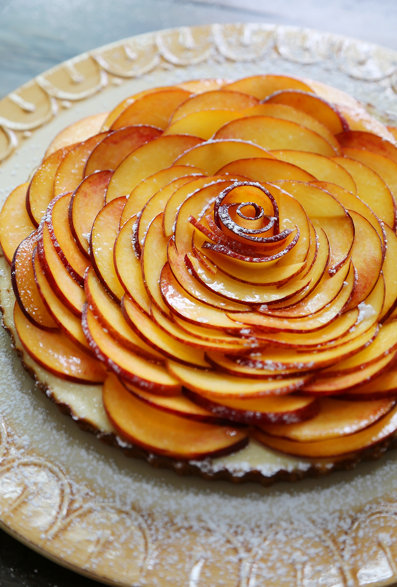 Creamy Peach and Honey Tart - Silky, rich cheesecake tart with a 5-ingredient filling. The perfect simple summer dessert! thecomfortofcooking.com