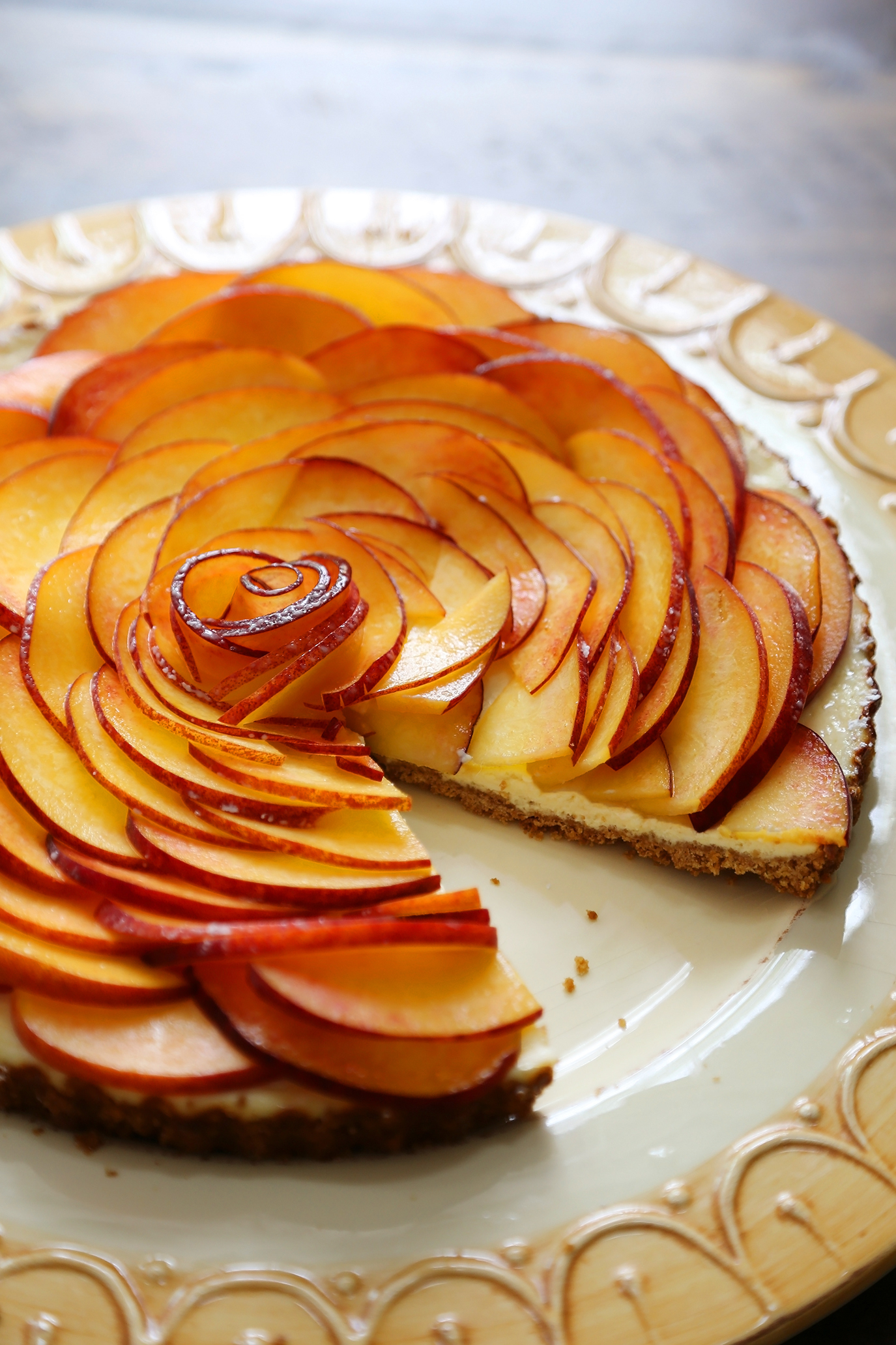 Creamy Peach and Honey Tart - Silky, rich cheesecake tart with a 5-ingredient filling. The perfect simple summer dessert! thecomfortofcooking.com