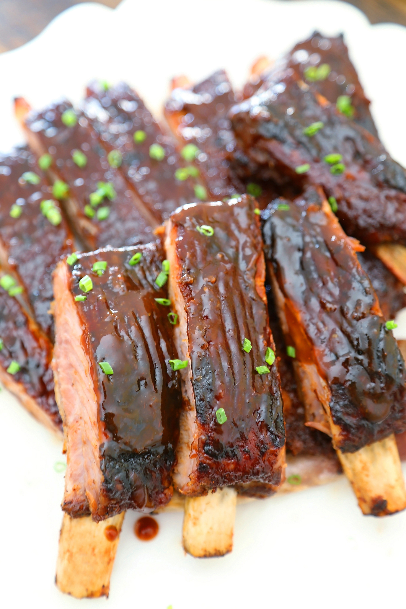 Sticky BBQ Spareribs - Melt-in-your-mouth, saucy BBQ spare ribs made in under 30 minutes! thecomfortofcooking.com