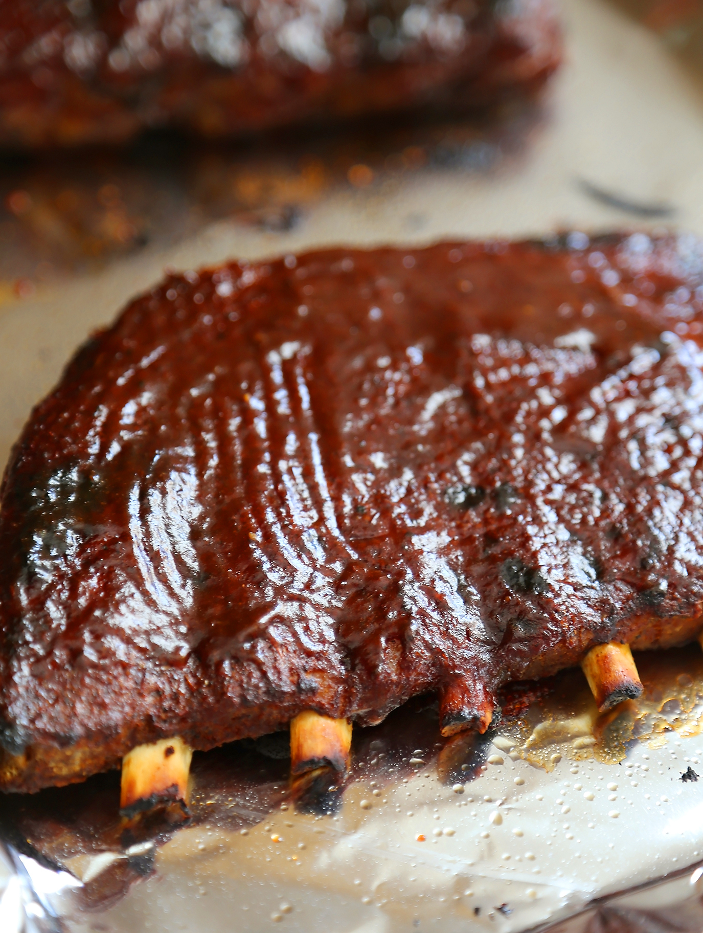 Sticky BBQ Spareribs - Melt-in-your-mouth, saucy BBQ spare ribs made in under 30 minutes! thecomfortofcooking.com