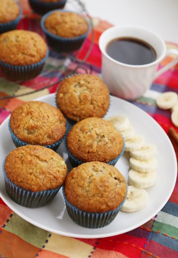 Toasted Coconut Banana Muffins - Super moist, fluffy banana muffins. These make a mouthwatering treat that pairs perfectly with your morning coffee! Thecomfortofcooking.com
